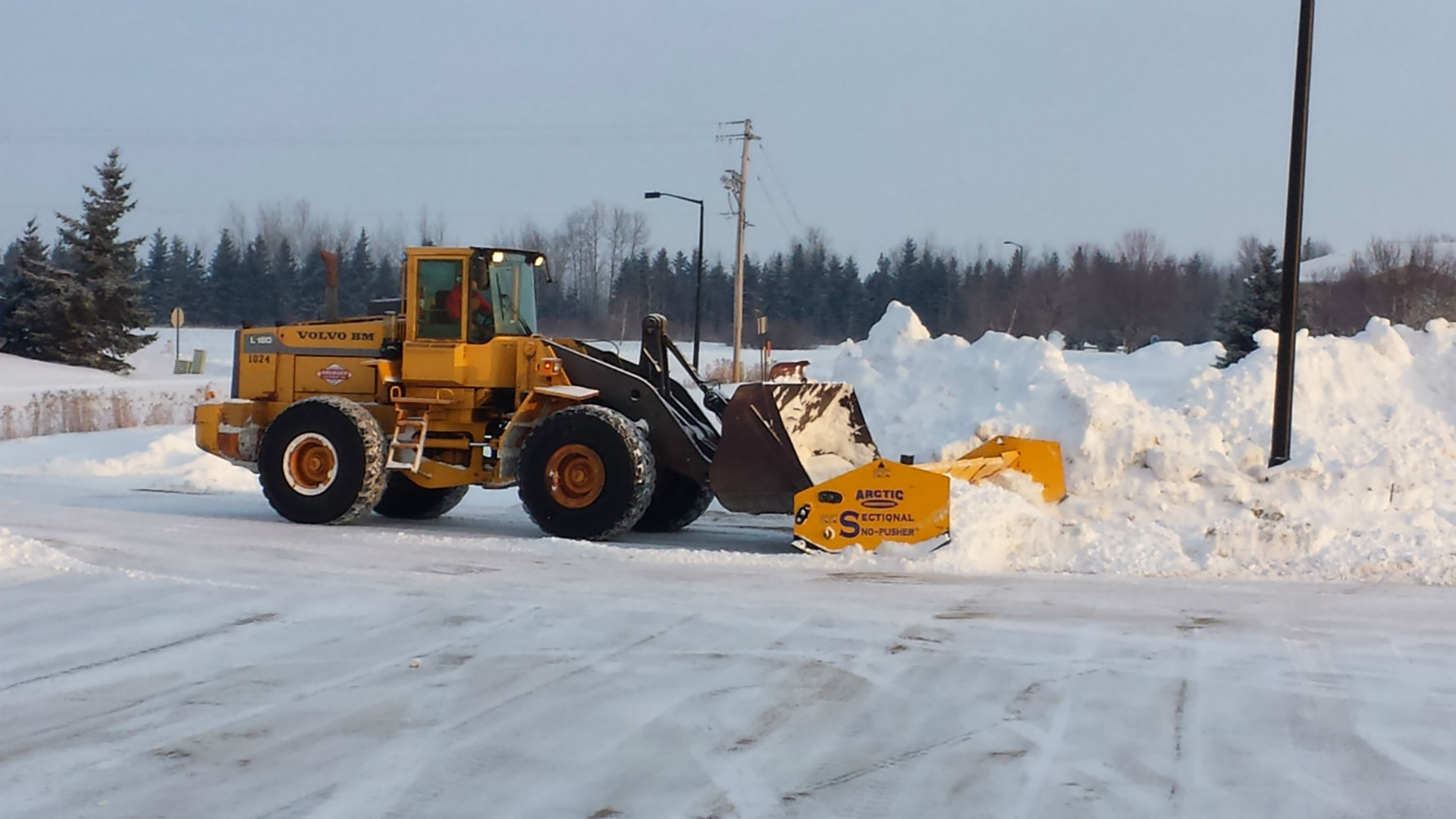 Commercial property having snow removal serviced in Ankeny, IA.