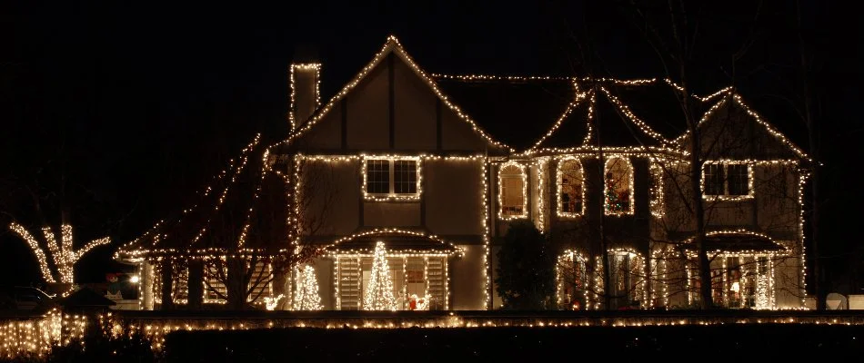 House in Waukee, IA, decorated with holiday lighting.