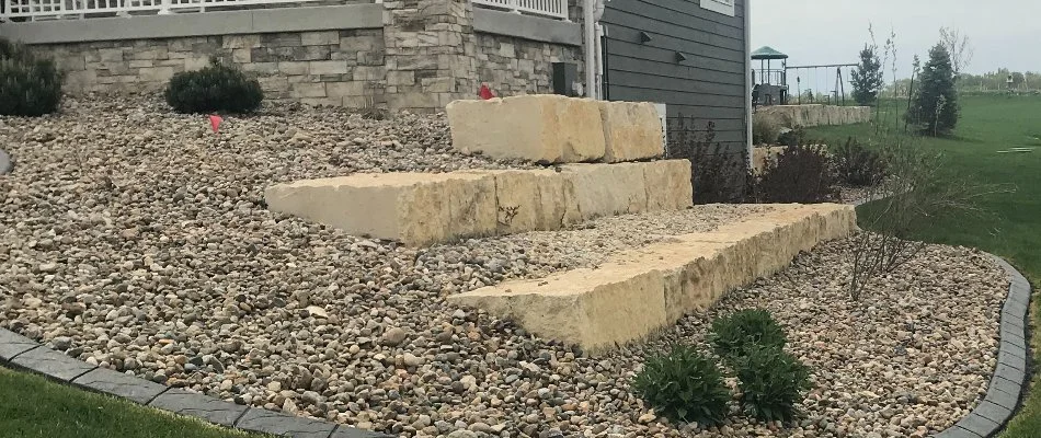 Retaining wall in Waukee, IA, with gravel.
