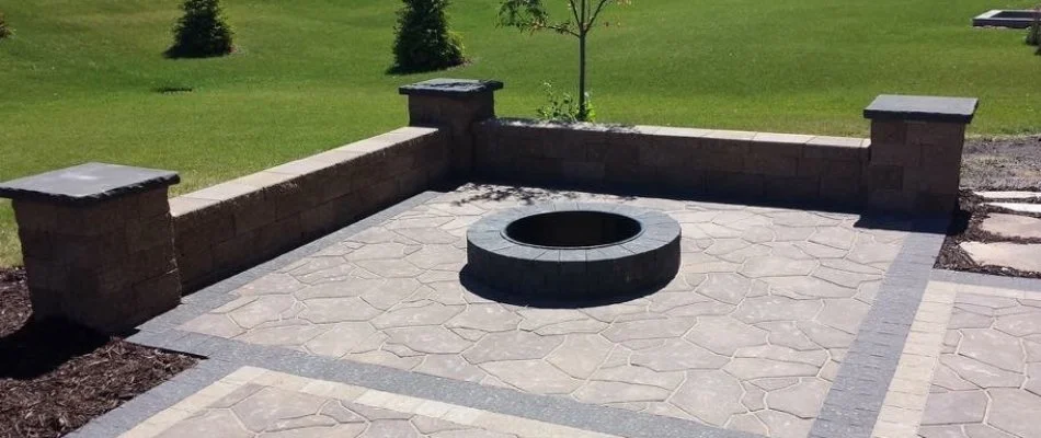 Seating wall around a fire pit in Waukee, IA.