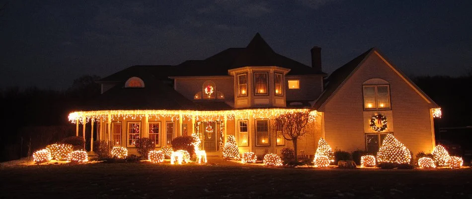 Warm white Christmas lights on a house in Waukee, IA.