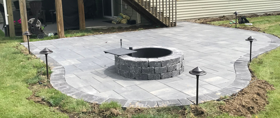 New fire pit feature installed over patio in Waukee, IA.