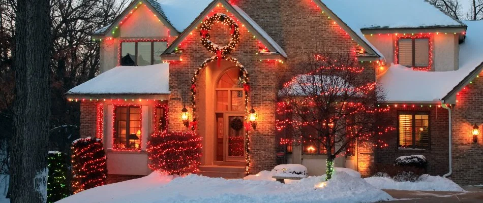 Home in Waukee, IA, decorated with colorful holiday lights.