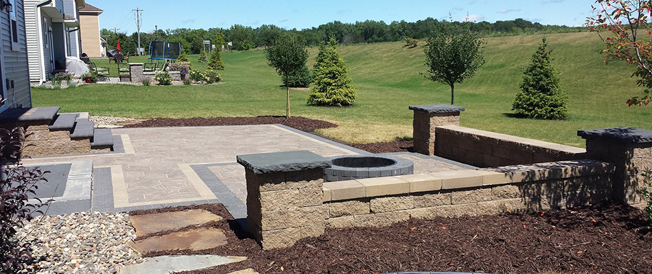 A new patio with fire pit and outdoor steps installed in West Des Moines, IA.