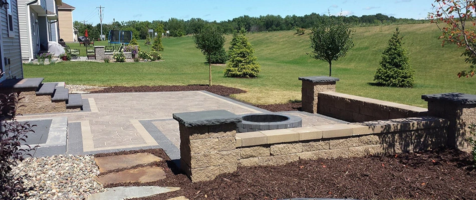 A new patio with fire pit and outdoor steps installed in West Des Moines, IA.