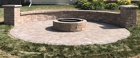 Patio, seating wall, and fire pit installed in Waukee, IA.