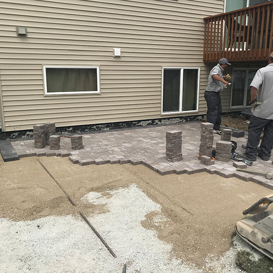 Professionals building a patio in Ankeny, IA.