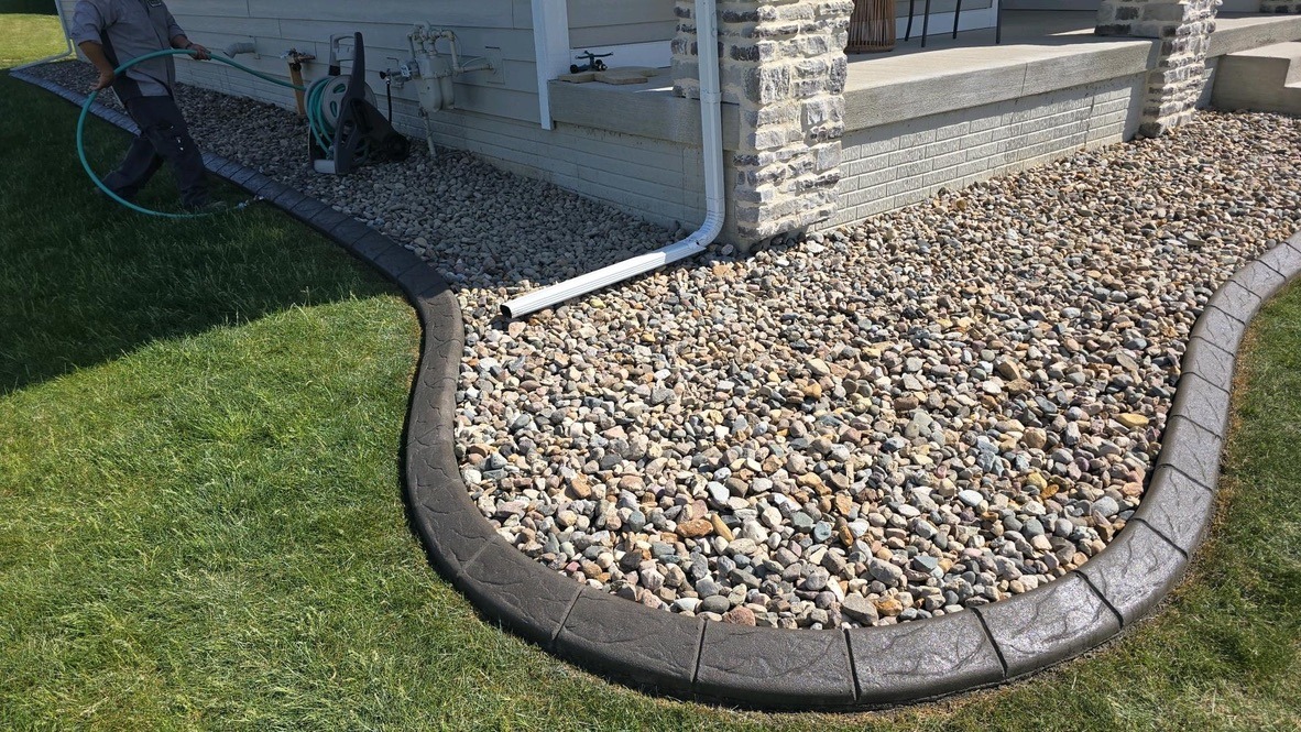 Downspout drainage system in a backyard
