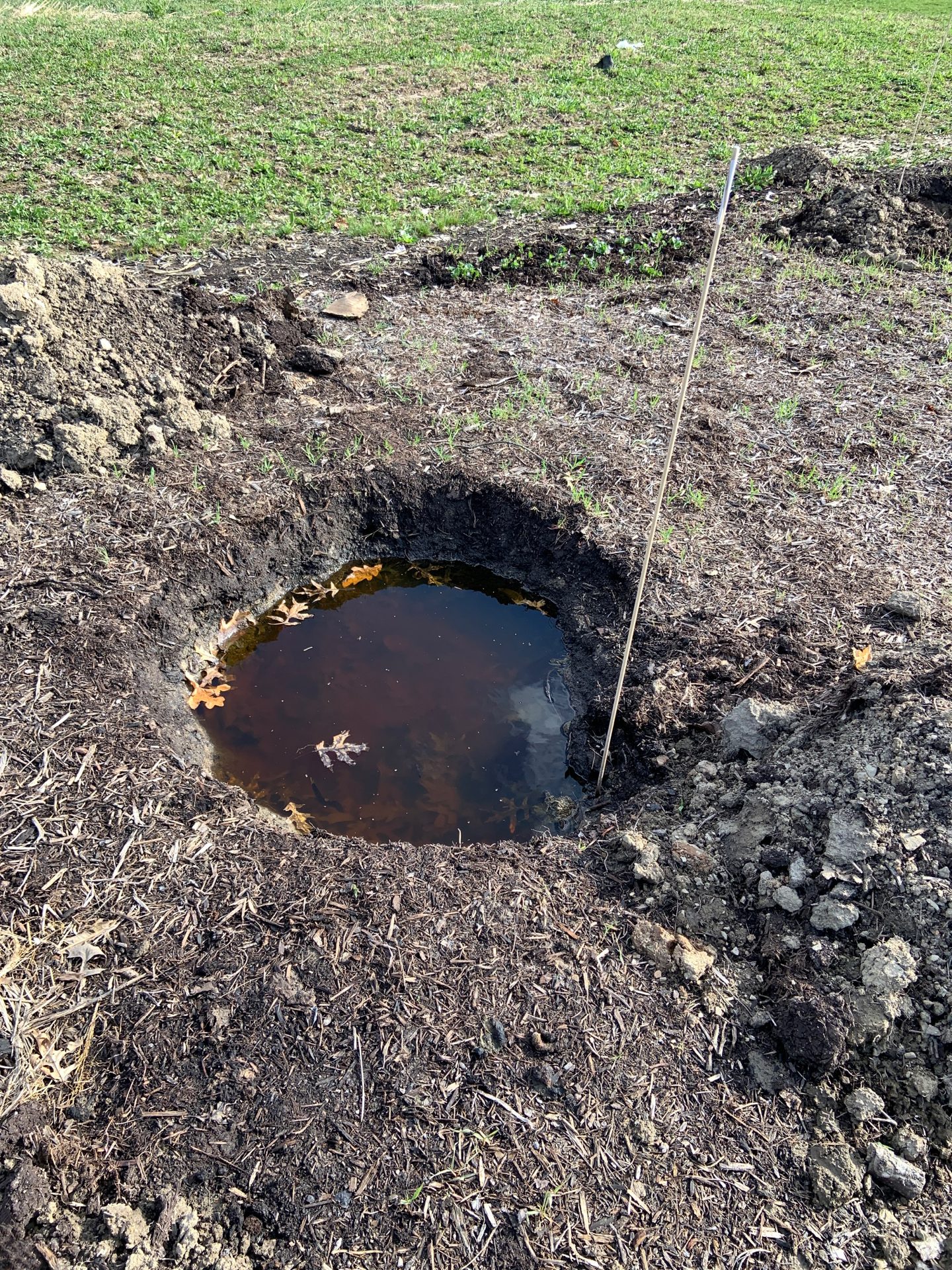 A large hole filled with water
