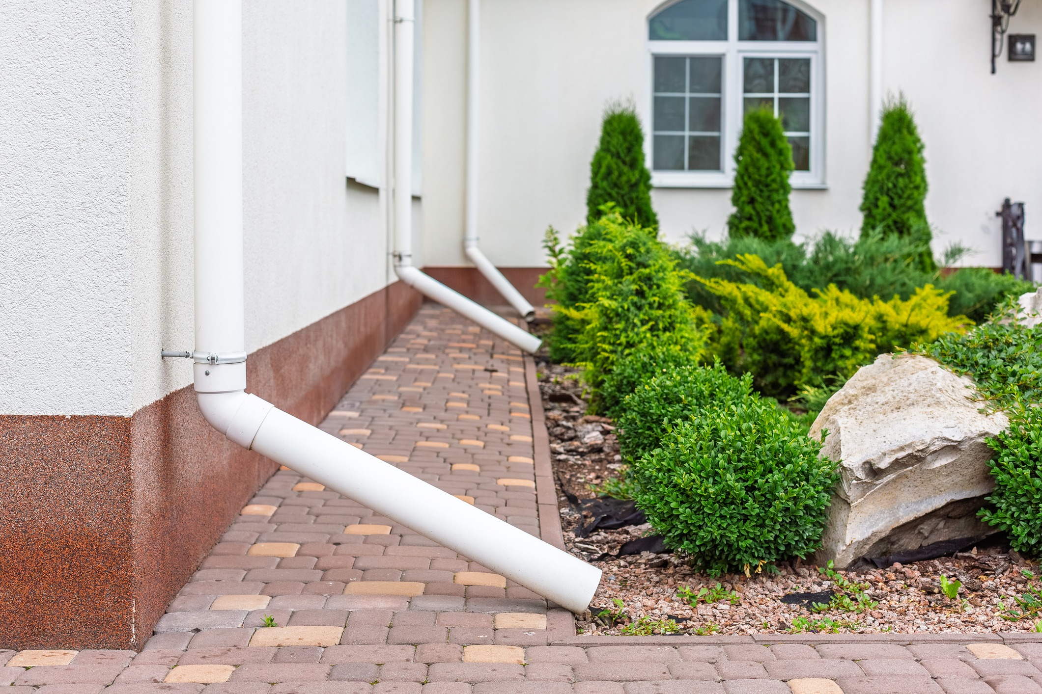 Downspout Drainage System Next to House Foundation